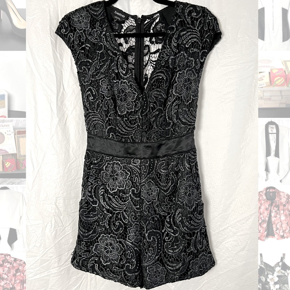 New black Bebe romper with metallic floral lace detail and satin tie
